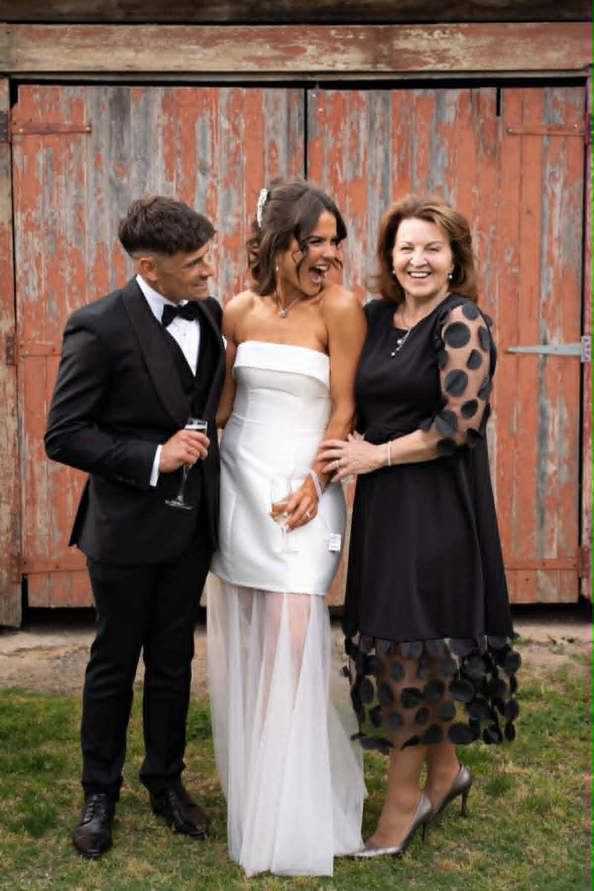 celebrant Cheryl Warry enjoying a laugh with the couple after the ceremony at The Plough Inn at Tarrawingee
