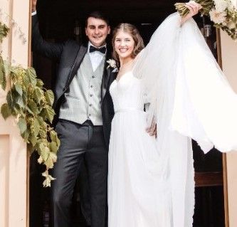 Couple exiting the Poowong Pioneer Chapel after being married by their celebrant Cheryl Warry
