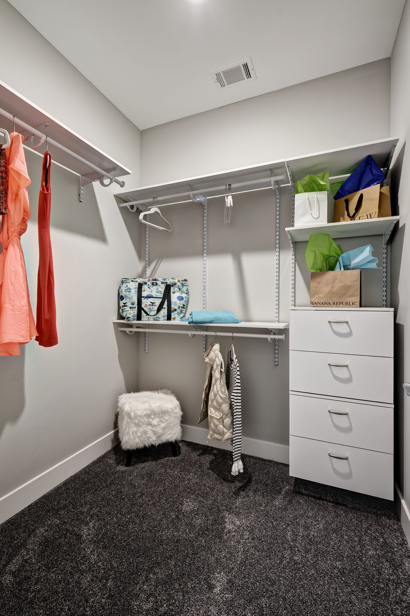 An artist 's impression of a walk in closet in a house.