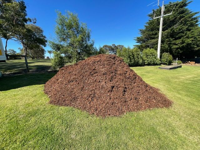 Large Pile Of Brown Mulch.
