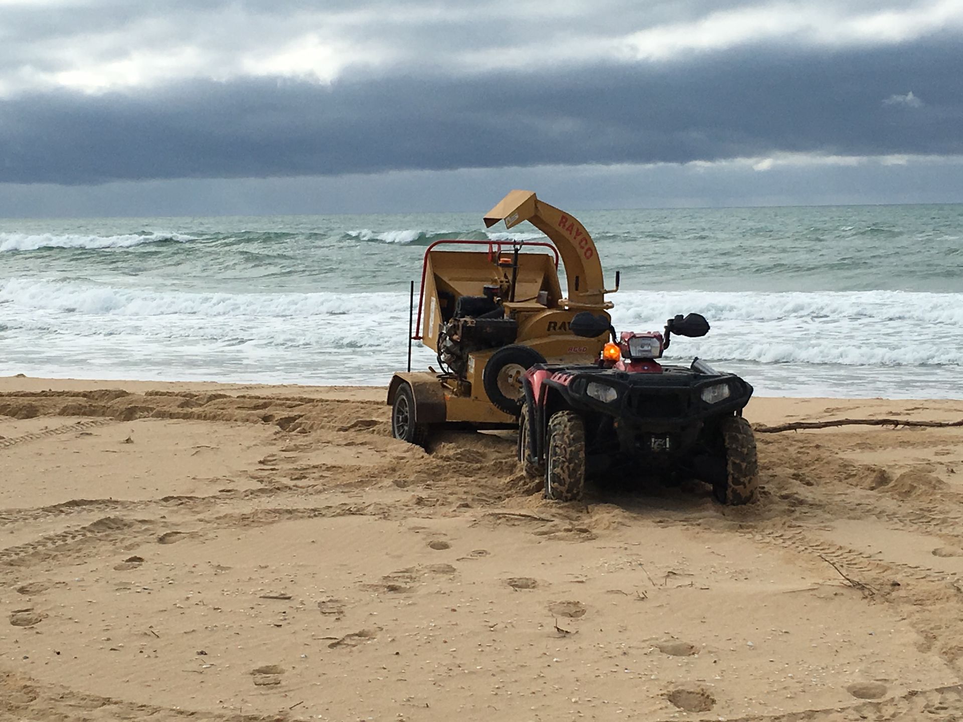 Machine And Atv On Beach.
