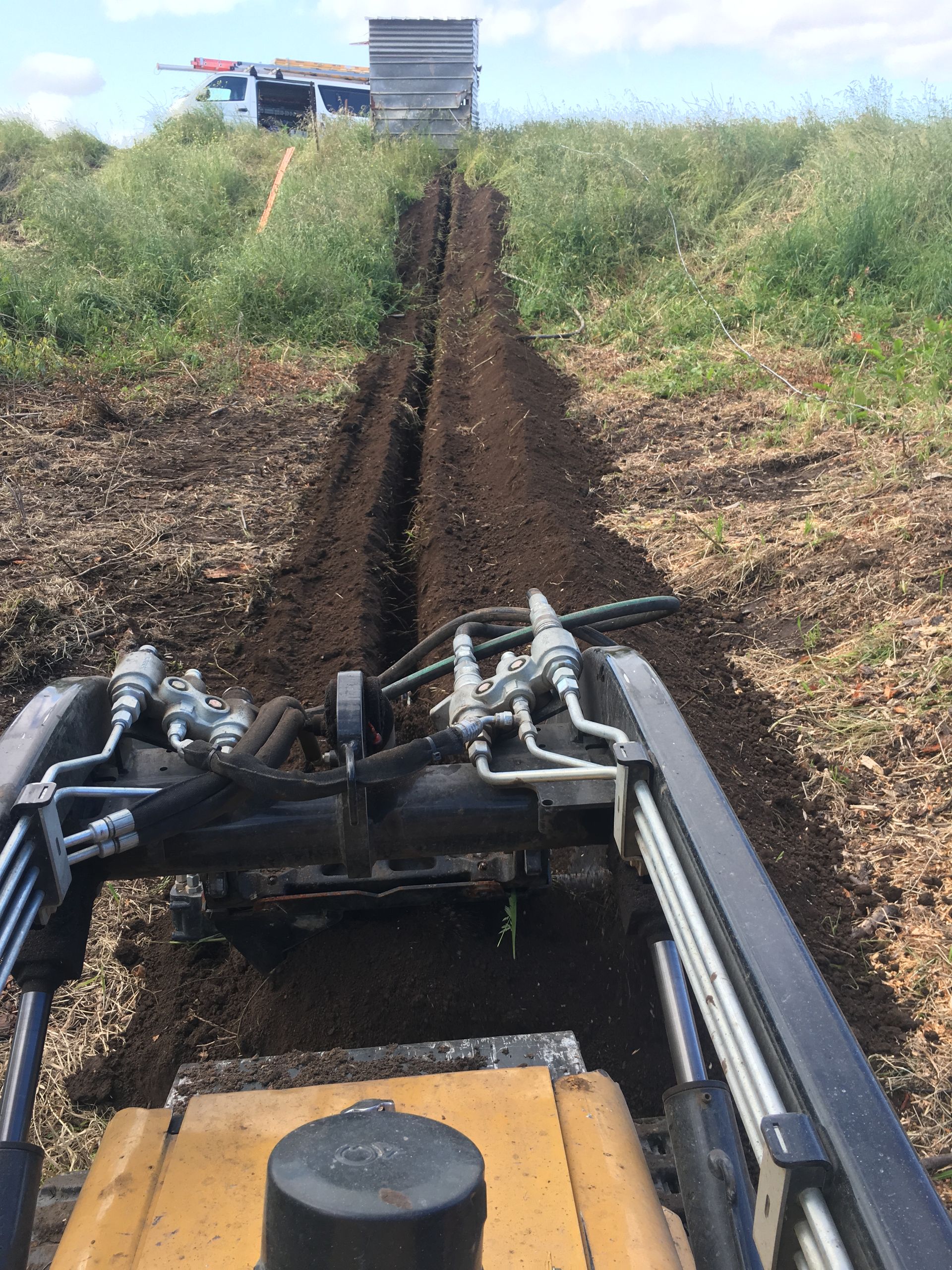 Mini Excavator Digging A Trench.

