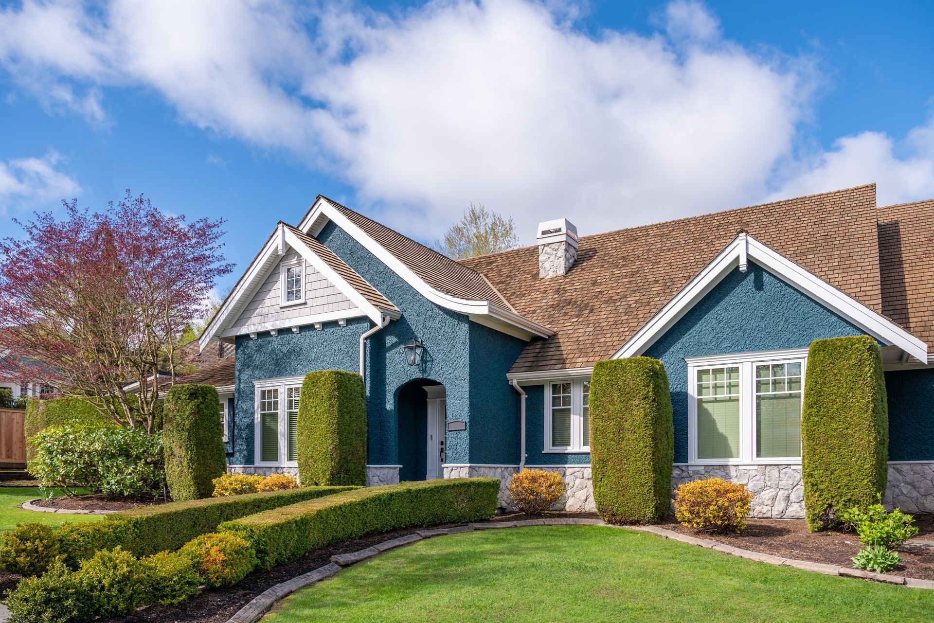 Blue house with brown roof