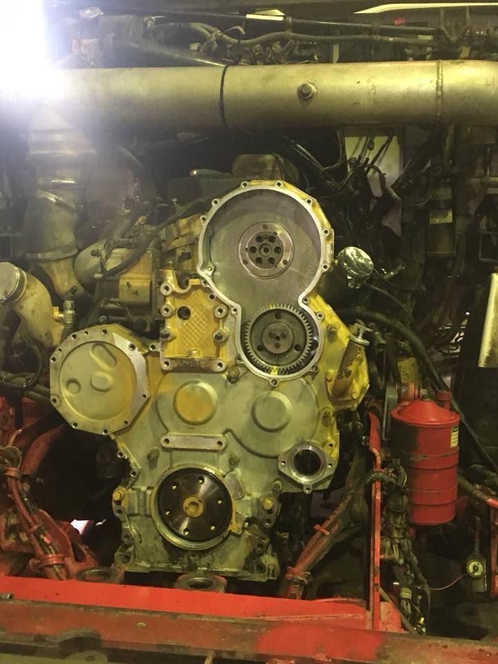 A Large Yellow Engine is Being Worked on in a Garage — Trucks On The Run Pty Ltd in Pittsworth, QLD