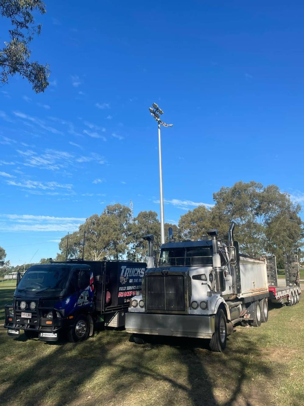 Two Trucks Are Parked Next to Each Other in a Field — Trucks On The Run Pty Ltd in Highfields, QLD