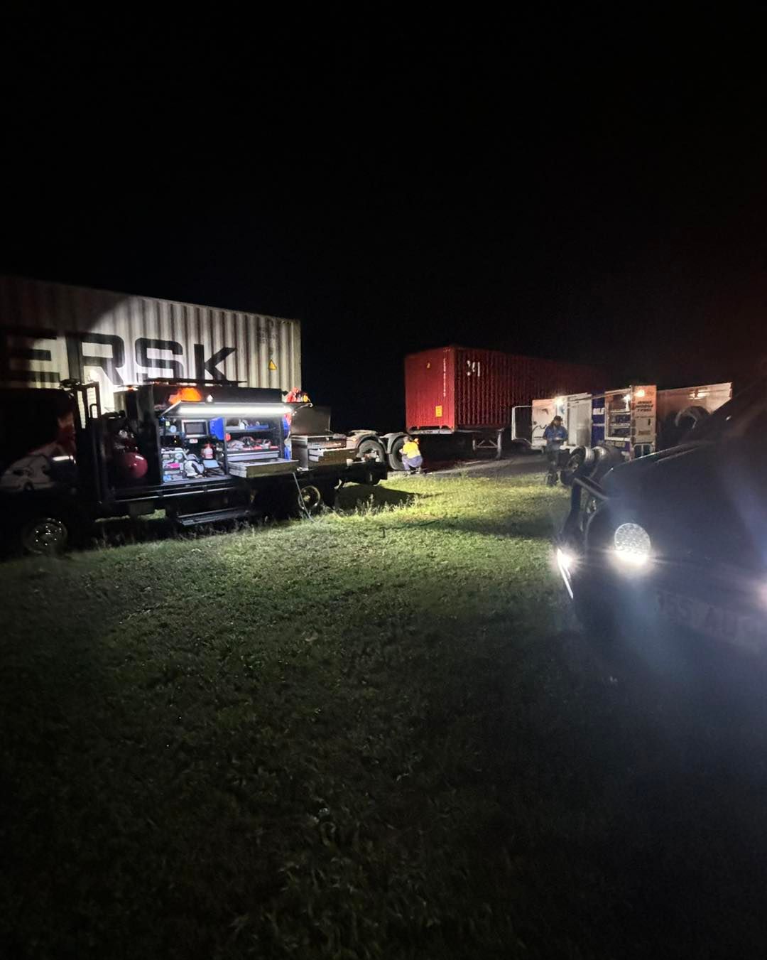 A Lot of Trucks Are Parked in a Parking Lot at Night — Trucks On The Run Pty Ltd in Wellcamp, QLD