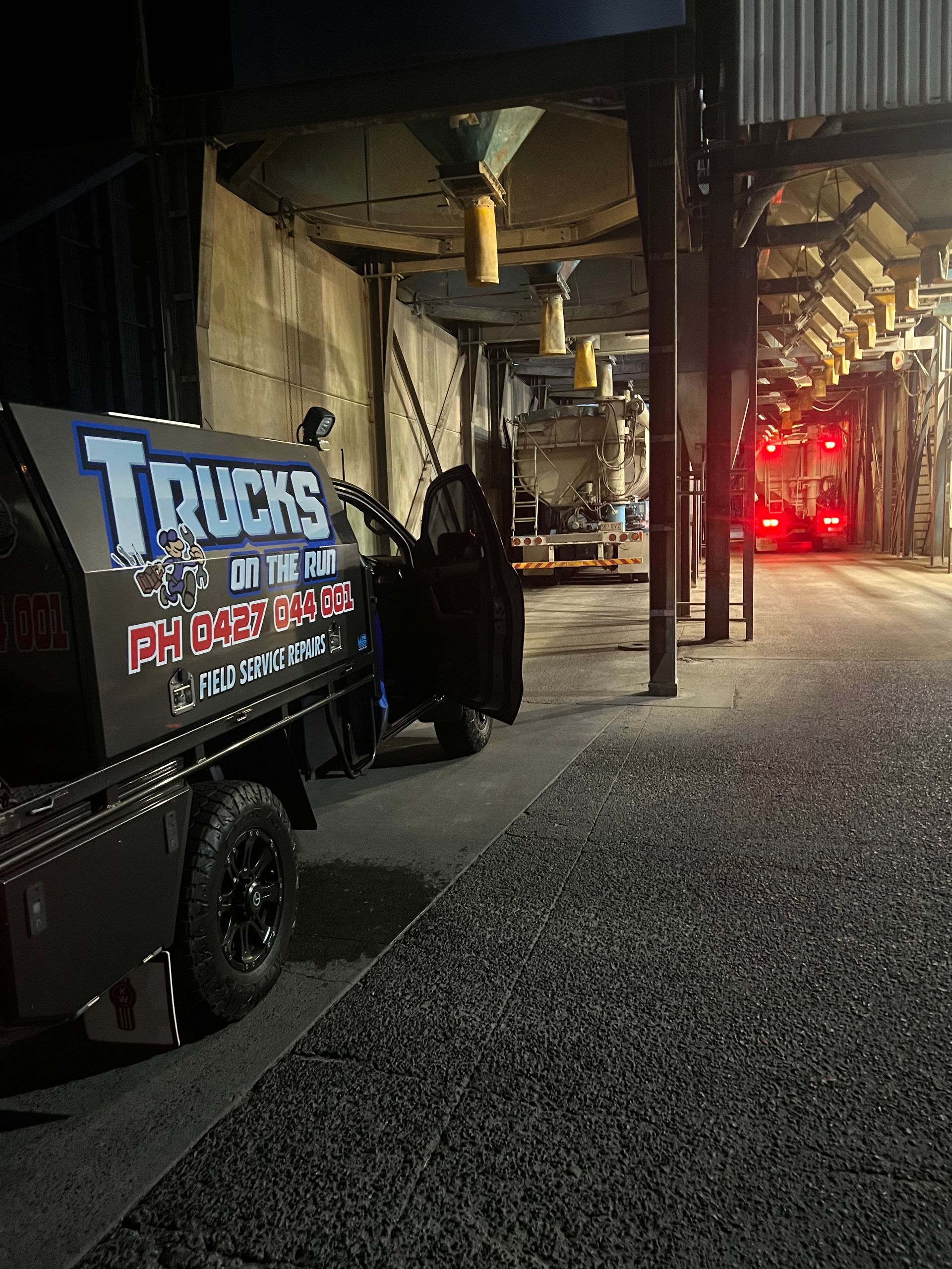 A Truck is Parked in Front of a Building at Night — Trucks On The Run Pty Ltd in Wilsonton, QLD
