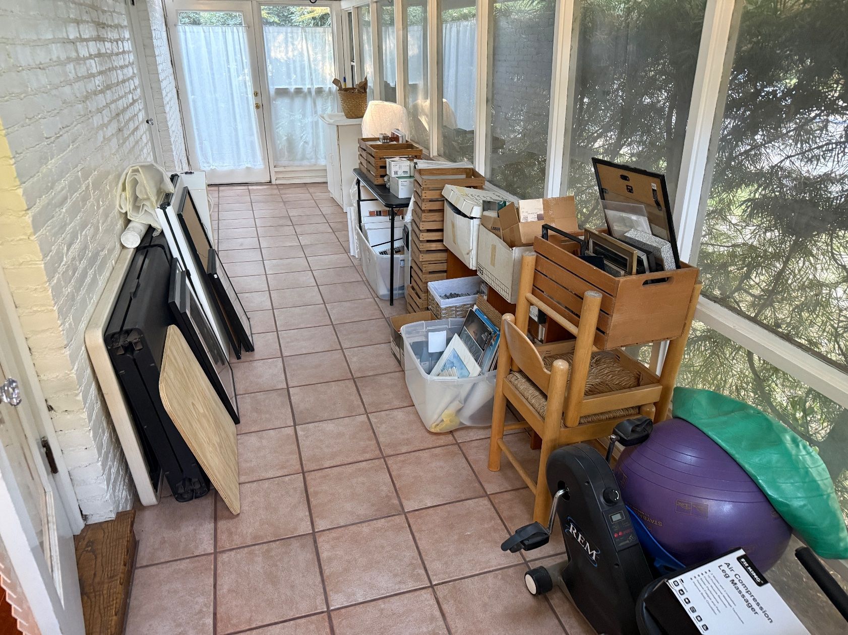 Sunroom before — house cleanout in Chico, CA