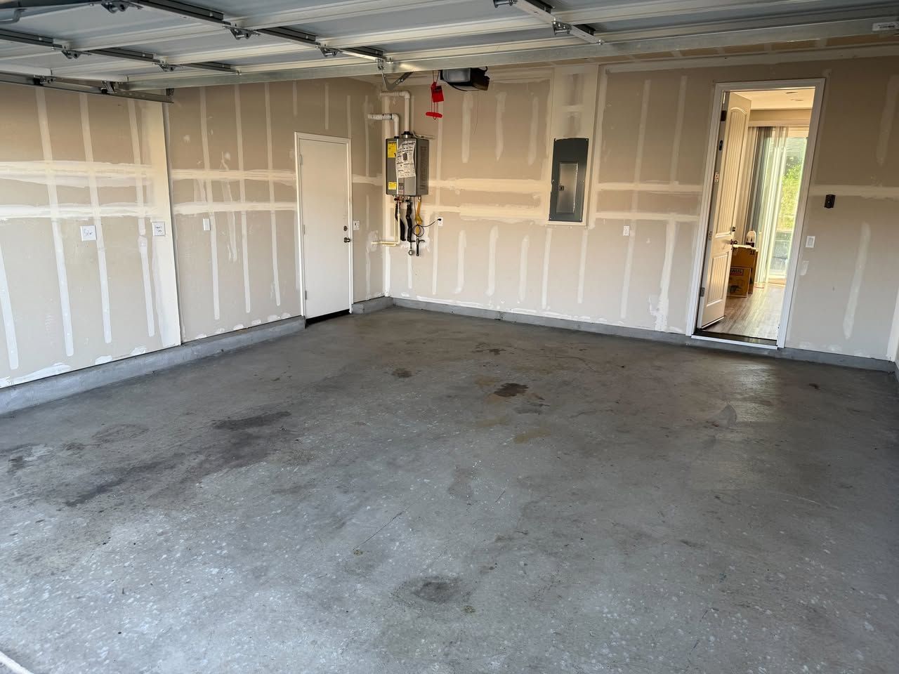 Garage Cleanouts in Butte County, CA — after: empty garage interior with concrete floor and white walls