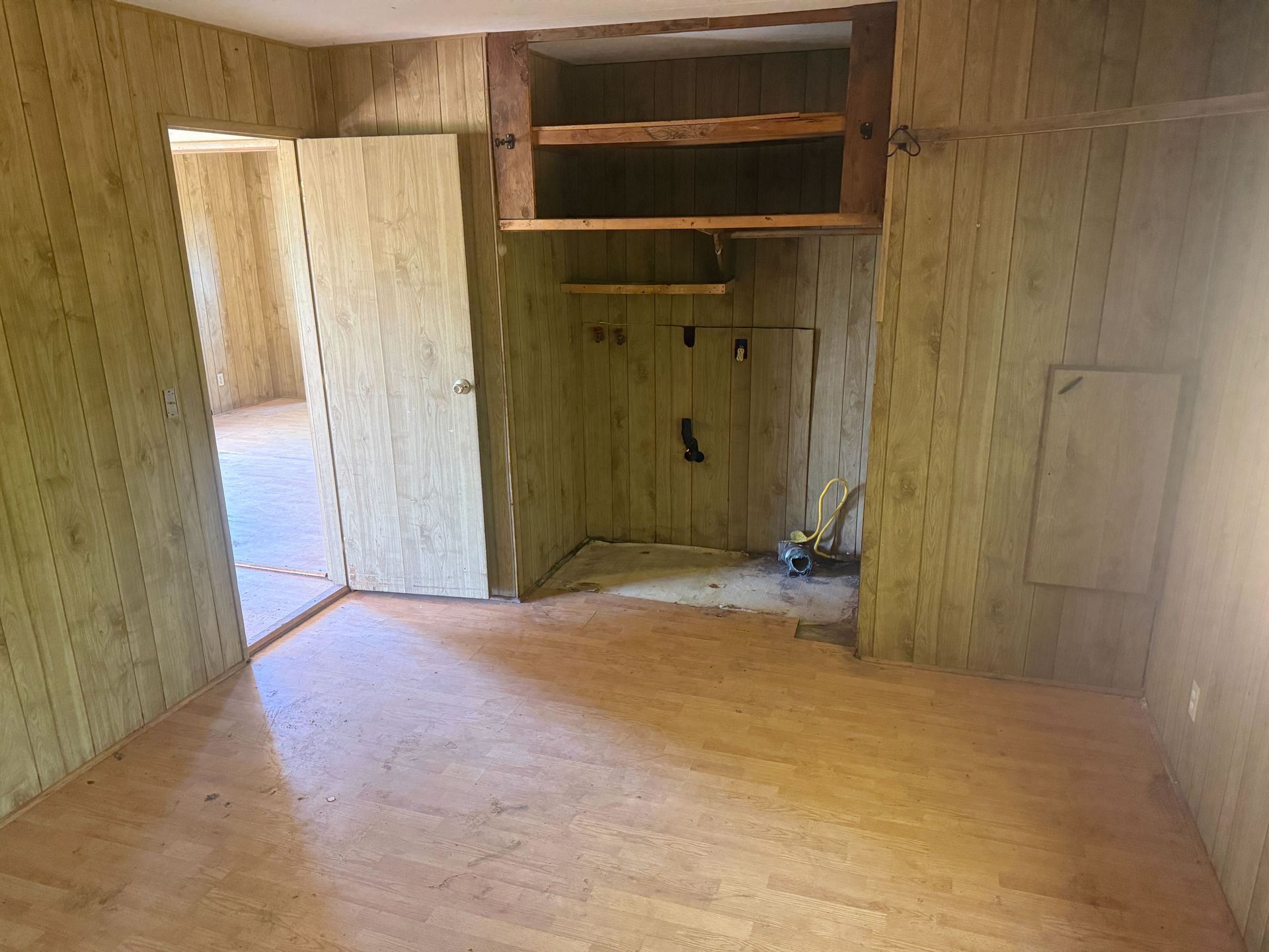 Hoarder cleanout in Gridley, CA — after: empty room with closet and clean floor