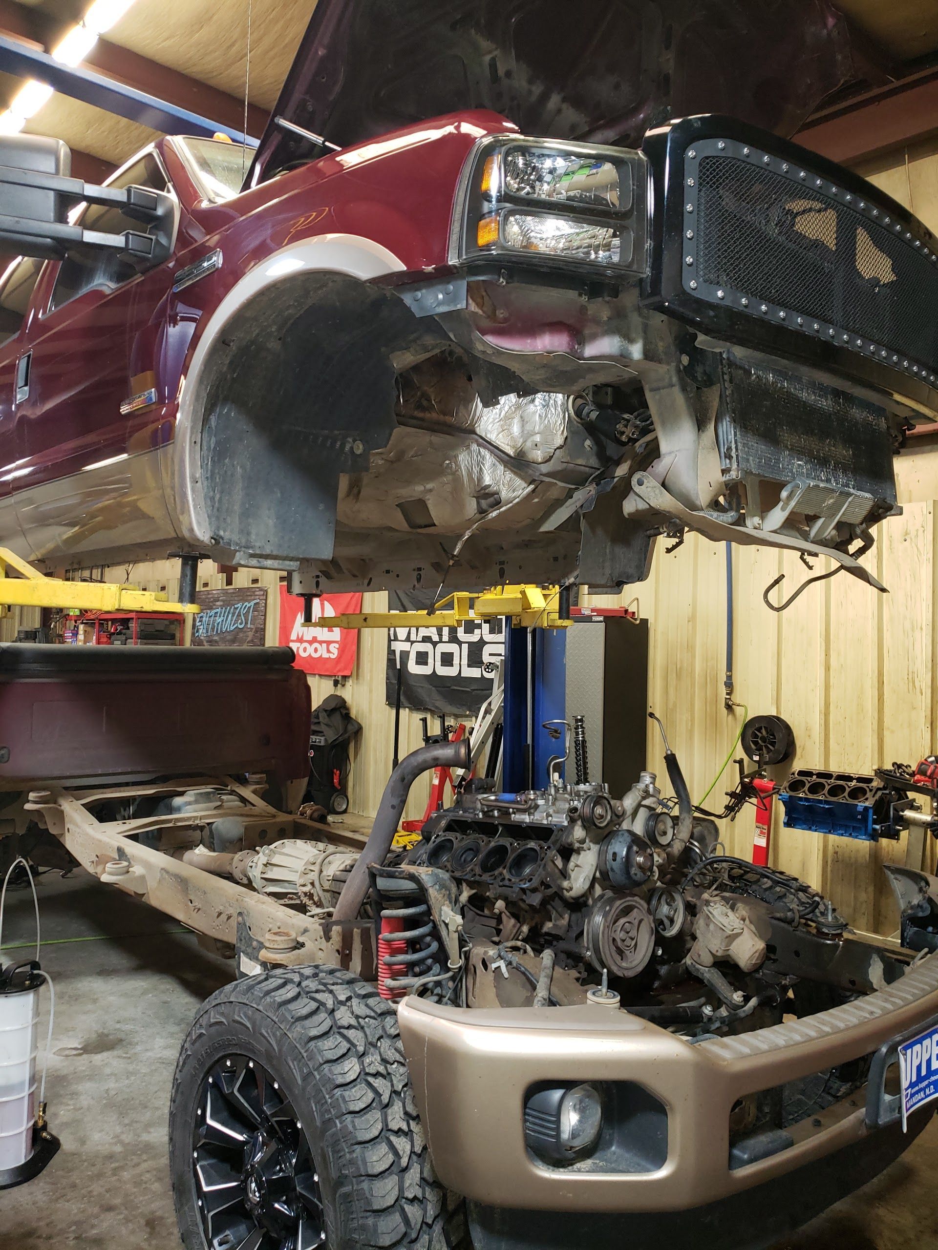 A Red Truck With the Hood Up Is Being Worked for Engine Repair  | Jake's Automotive and Diesel Repair
