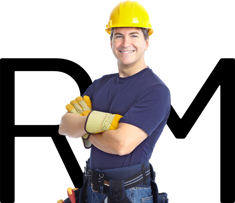 a man wearing a hard hat and gloves stands with his arms crossed