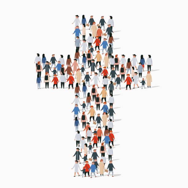 A large group of people are standing in the shape of a cross.