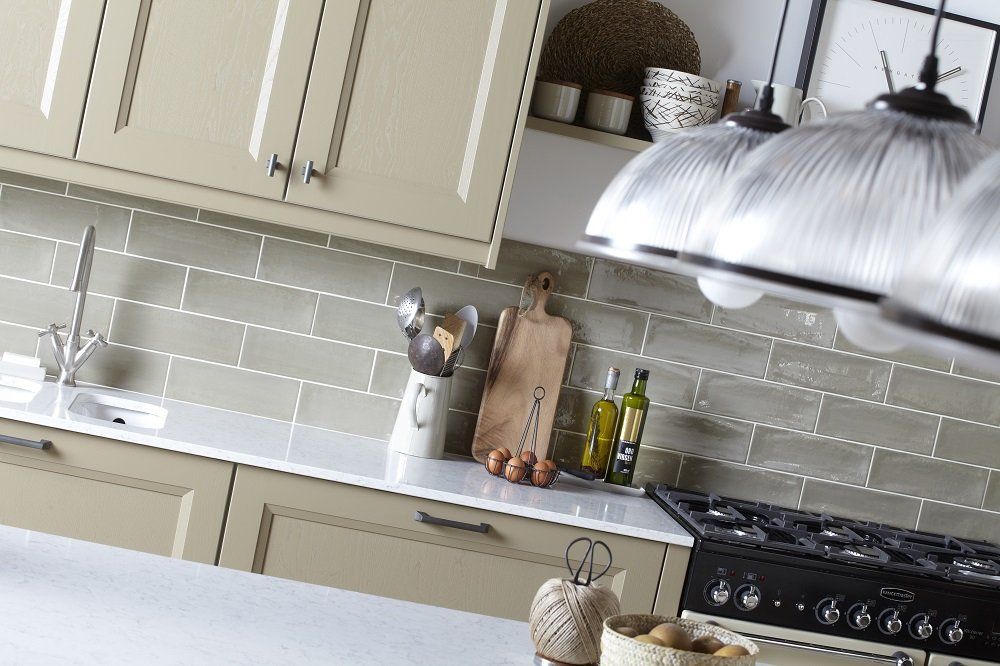 Gresham Bespoke colour wall and base cupboard, thin surface with light green brick tiles and