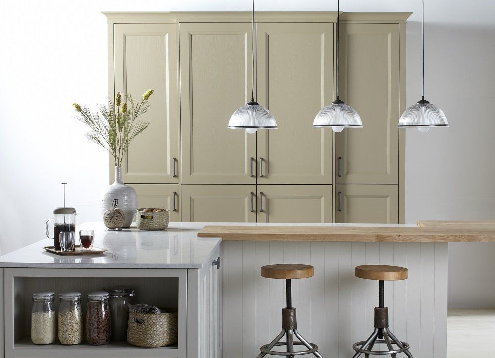 Gresham Bespoke Colour tall units with L shaped island with wooden worktop on a small section cafetiere and glass coffee mugs on surface
