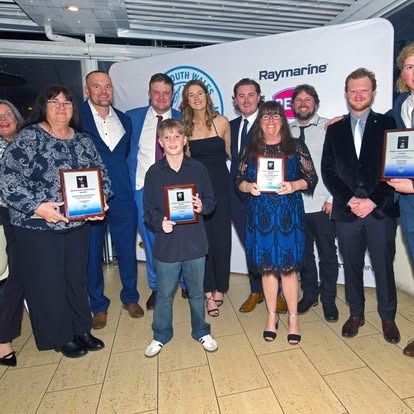 Group of people holding awards for the NSWGFC Presentation Night 23/24 Season