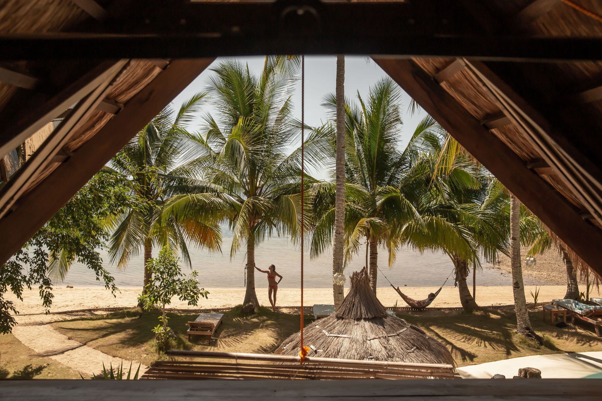 A view of a beach from inside a building
