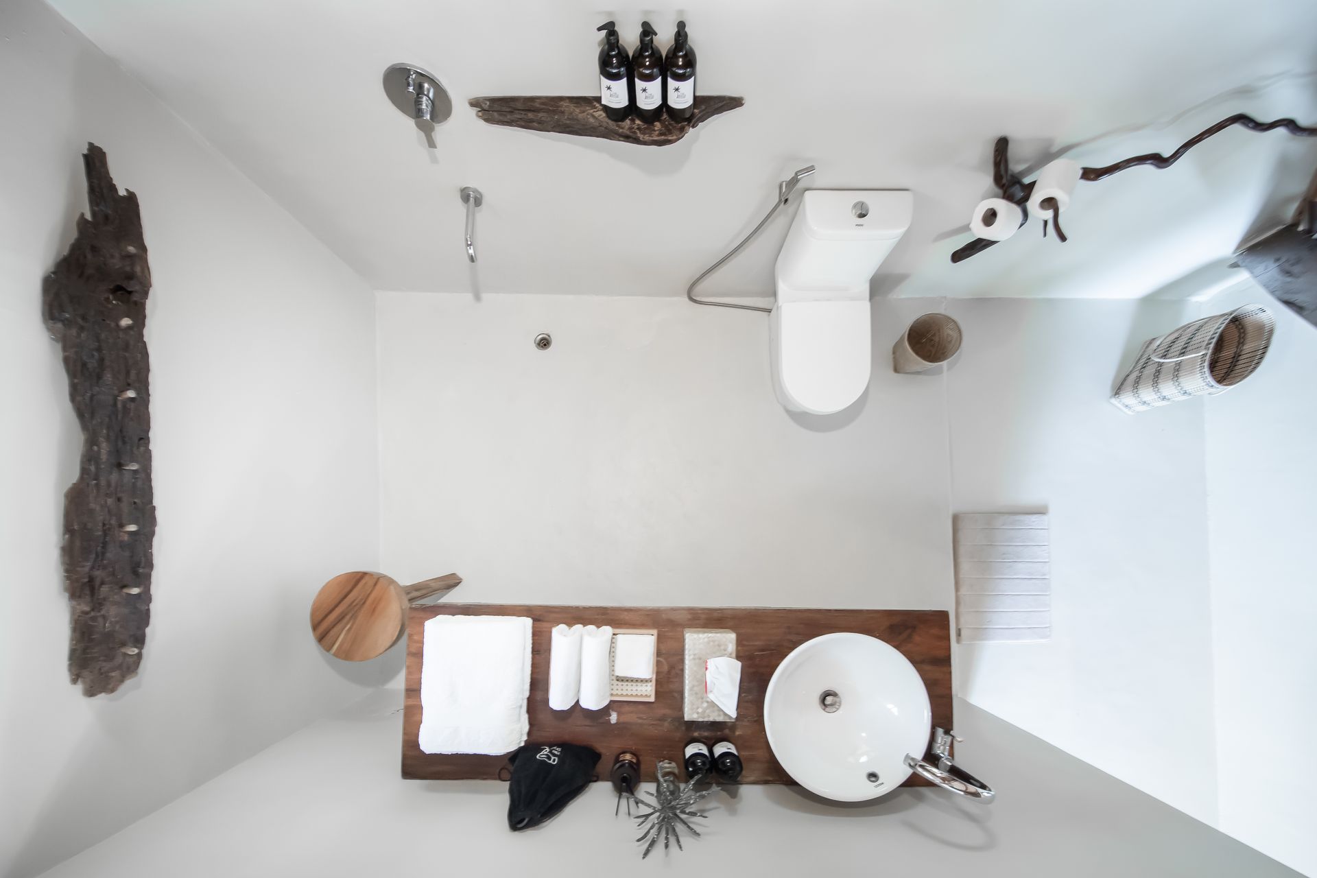 A bathroom with a sink , toilet and shower.