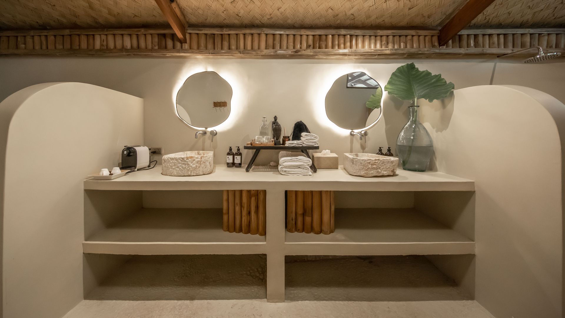 A bathroom with two sinks and two mirrors.