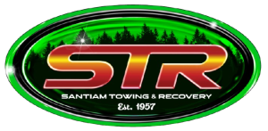 Green oval STR Santa Towings & Recovery logo with red and gold lettering, est. 1957