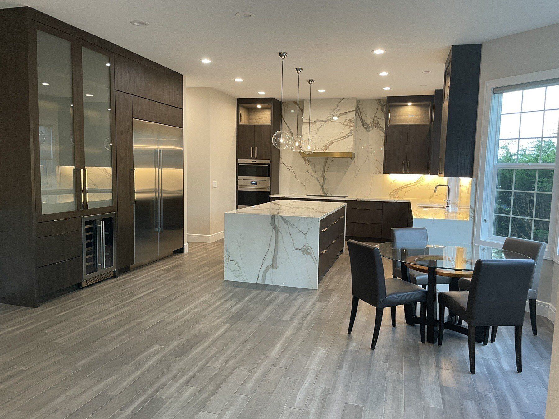 There is a large island in the middle of the kitchen.