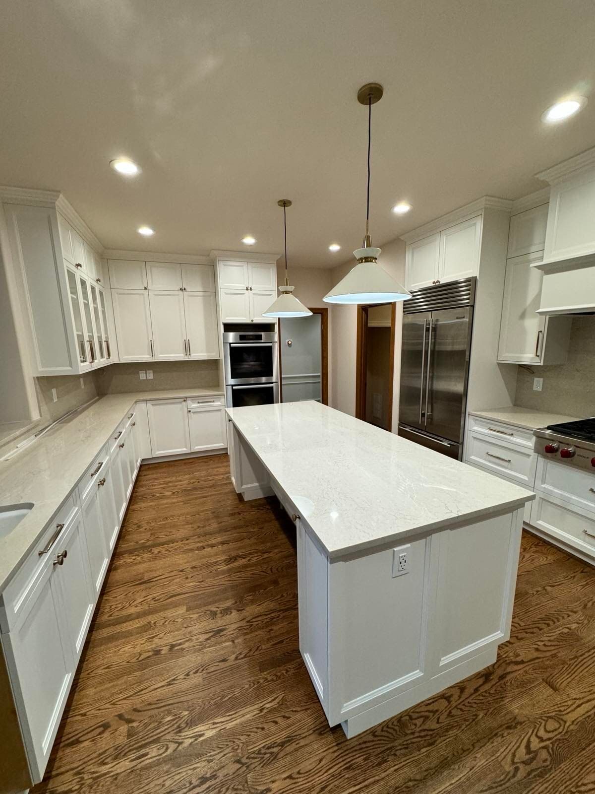 There is a large island in the middle of the kitchen.