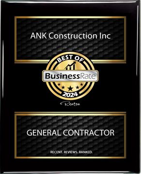 A black and gold plaque that says best of business rate and general contractor.
