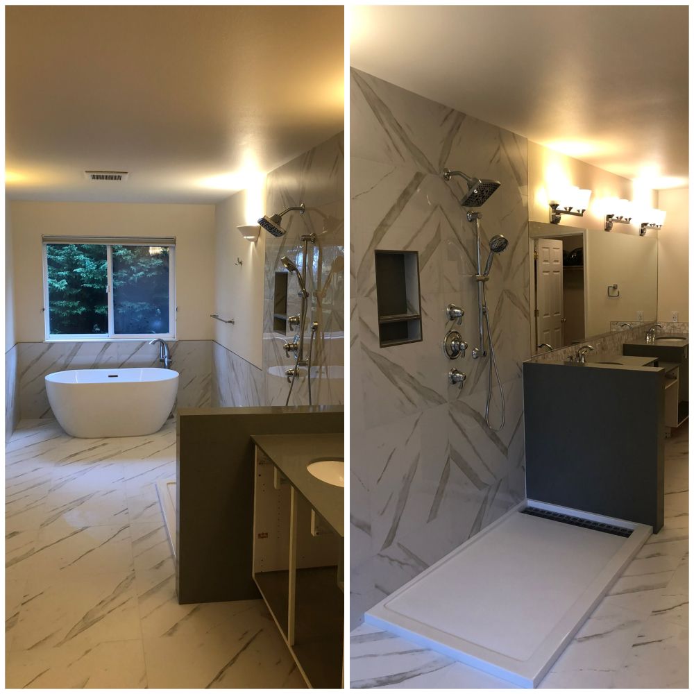 A bathroom with a bathtub and a shower
