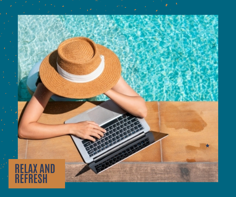 Woman wearing sun hat, working on laptop by pool at EVOQ East Cobb Marietta, GA.