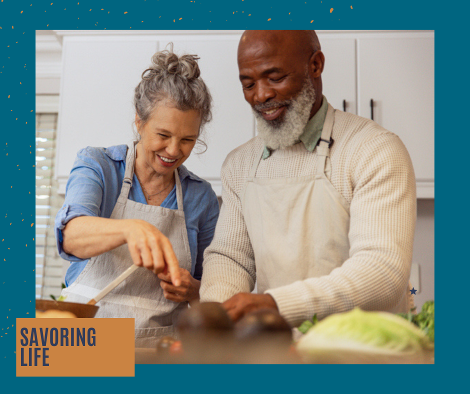 Two people cooking together in a bright kitchen, smiling and stirring food in a pan at EVOQ East Cobb Marietta, GA.