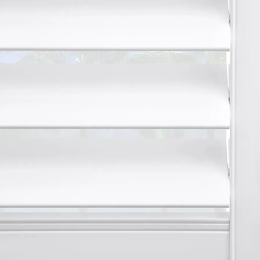 A close up of a white shutter on a window.