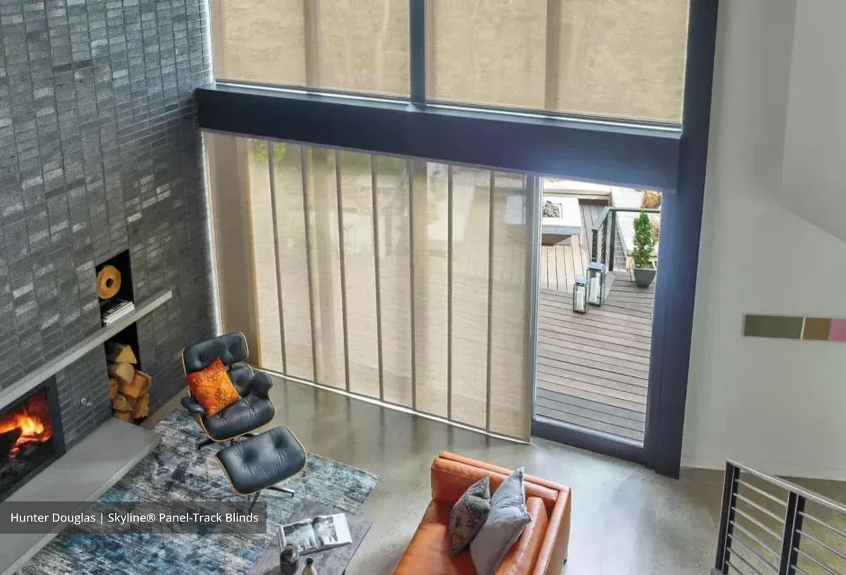 An aerial view of a living room with a couch and chairs
