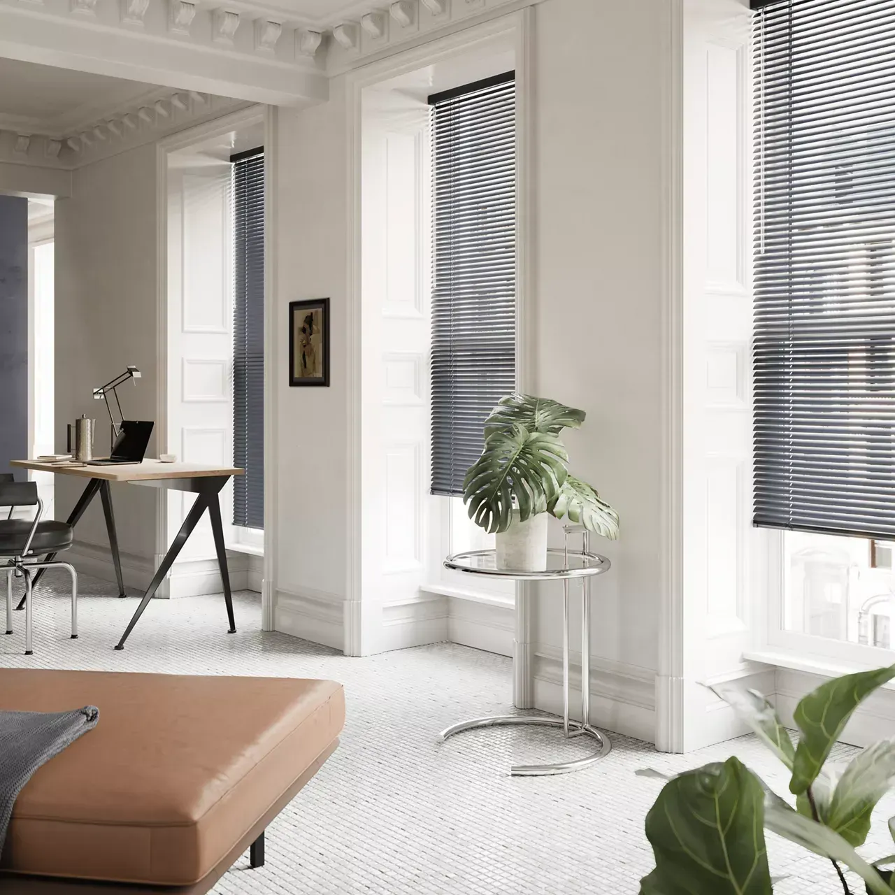A living room with a brown ottoman and a desk