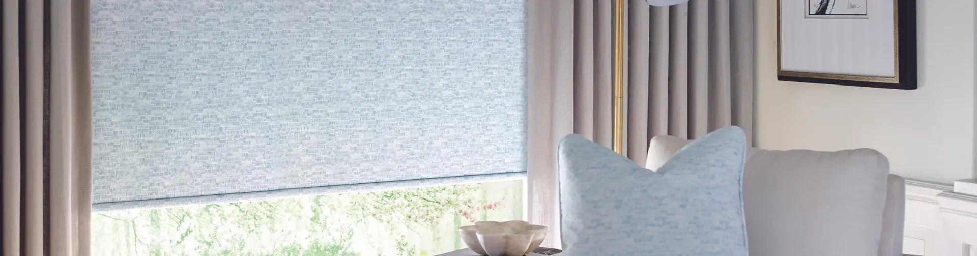 A living room with a chair and a window with blinds.