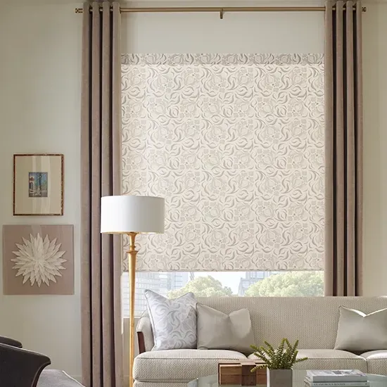 A living room with a couch , lamp , and window with blinds.