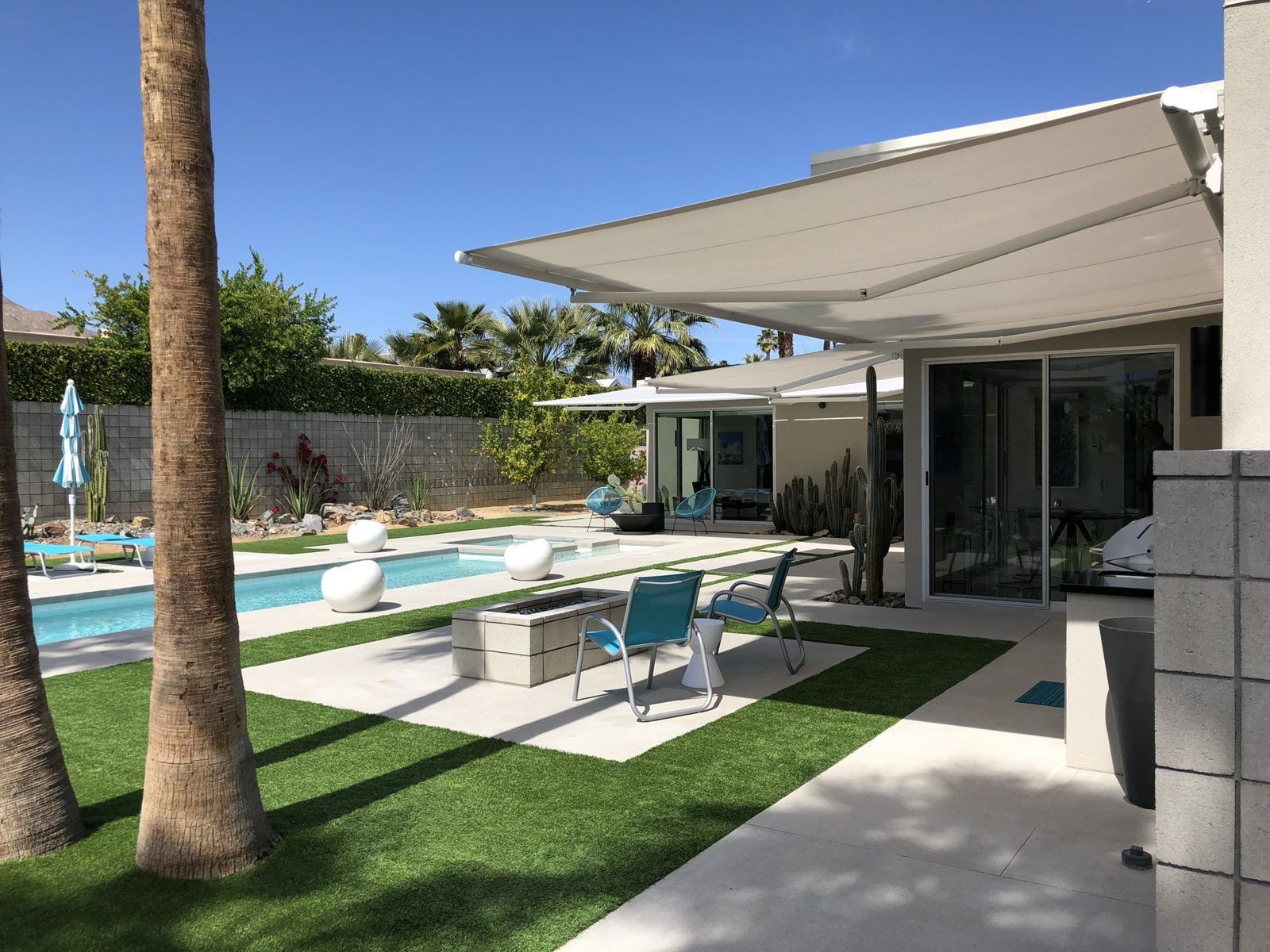 SunPro retractable awning over a modern poolside patio