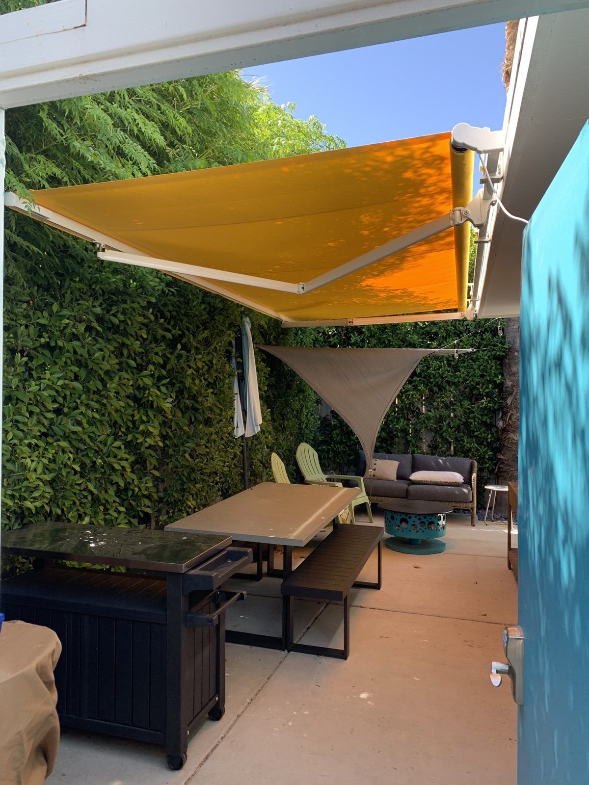 Retractable awning over a courtyard