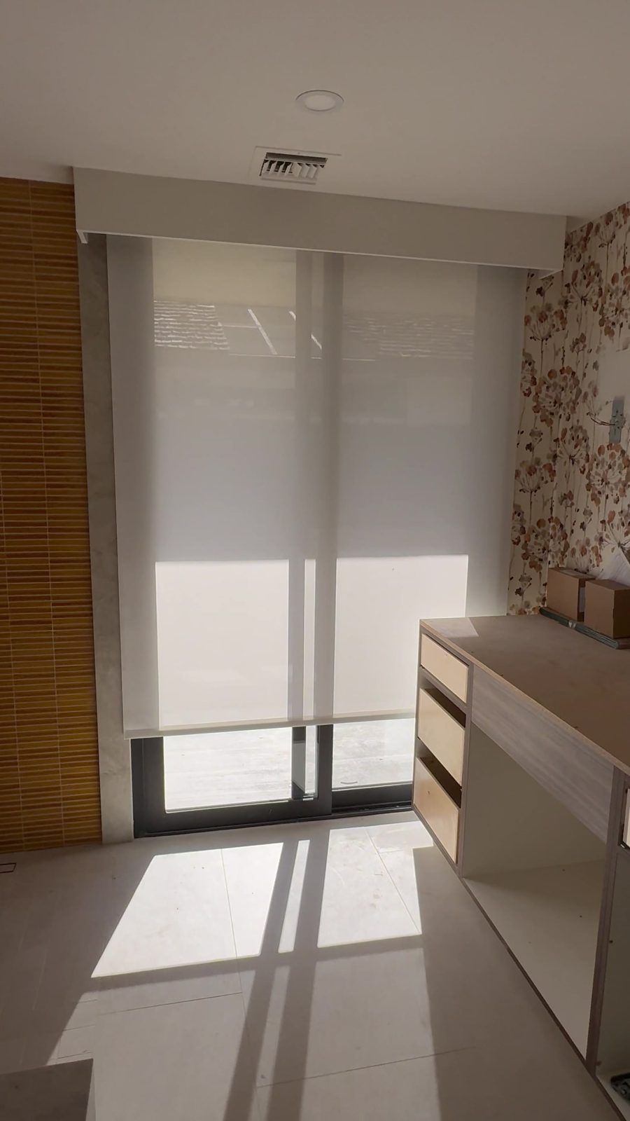 Motorized roller shade on a tall sliding door
