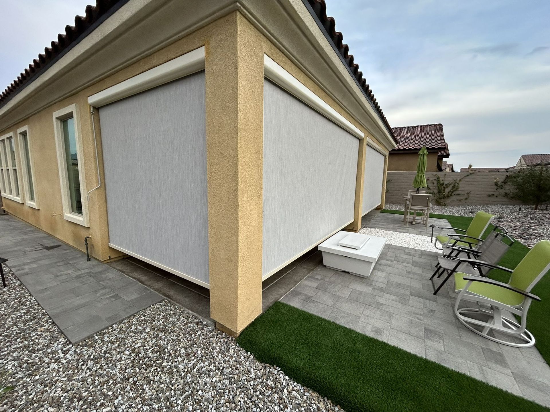 Exterior solar shades on a corner patio