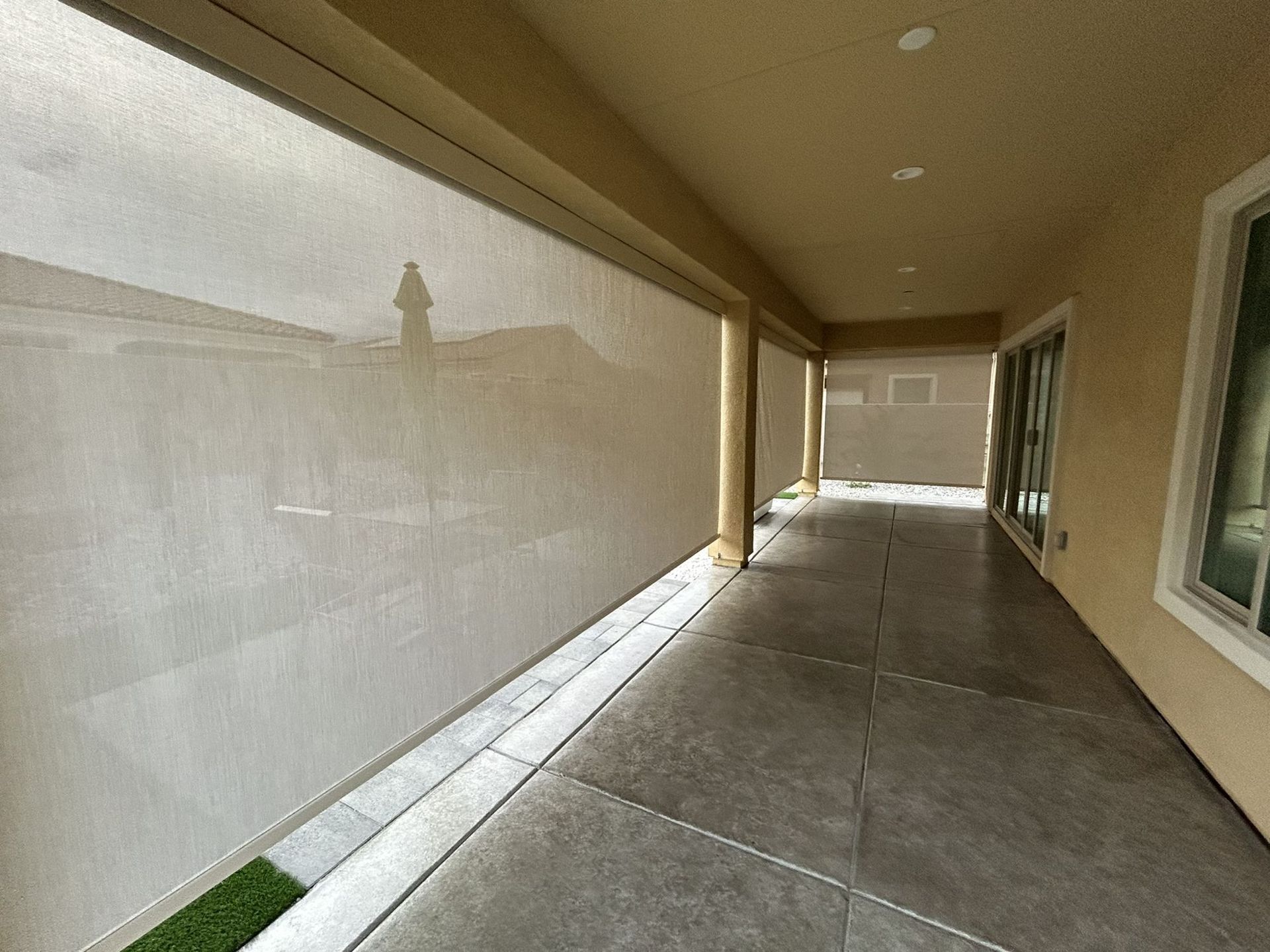 Exterior shade enclosing a covered patio
