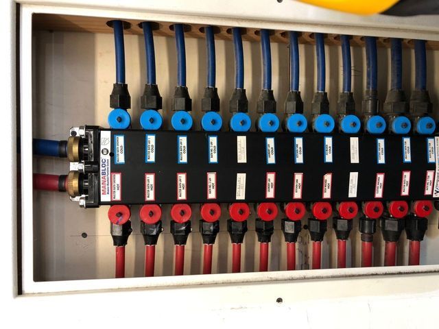 A bunch of wires are connected to a black box