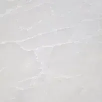 A close up of a white tile with a marble texture.
