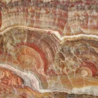A close up of a marble texture with a rainbow of colors.