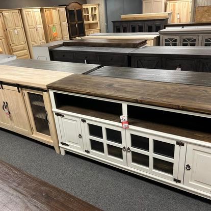 A bunch of wooden cabinets are lined up in a room.