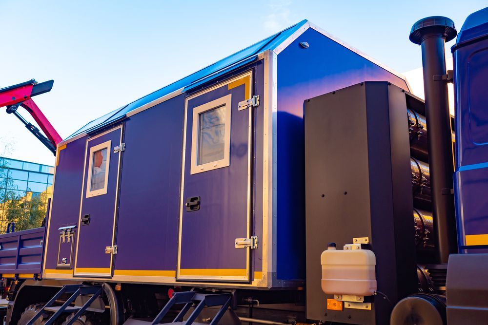 A Blue Truck with A Trailer Attached to It — NQ Trading In Edmonton, QLD