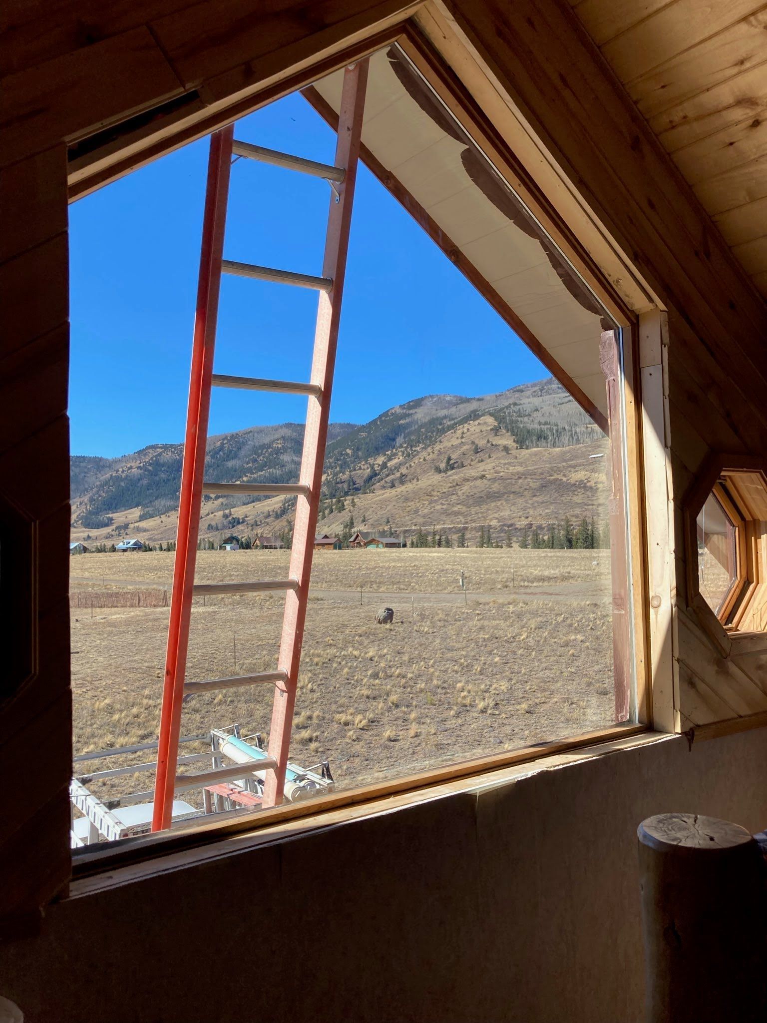 a room with hardwood floors and sliding glass doors installed by Sunglass