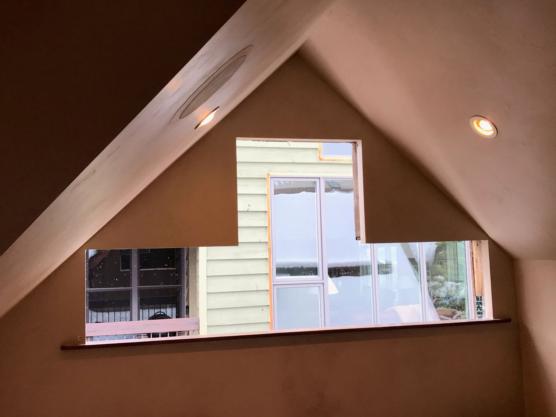 A room with a window in a very unique shape