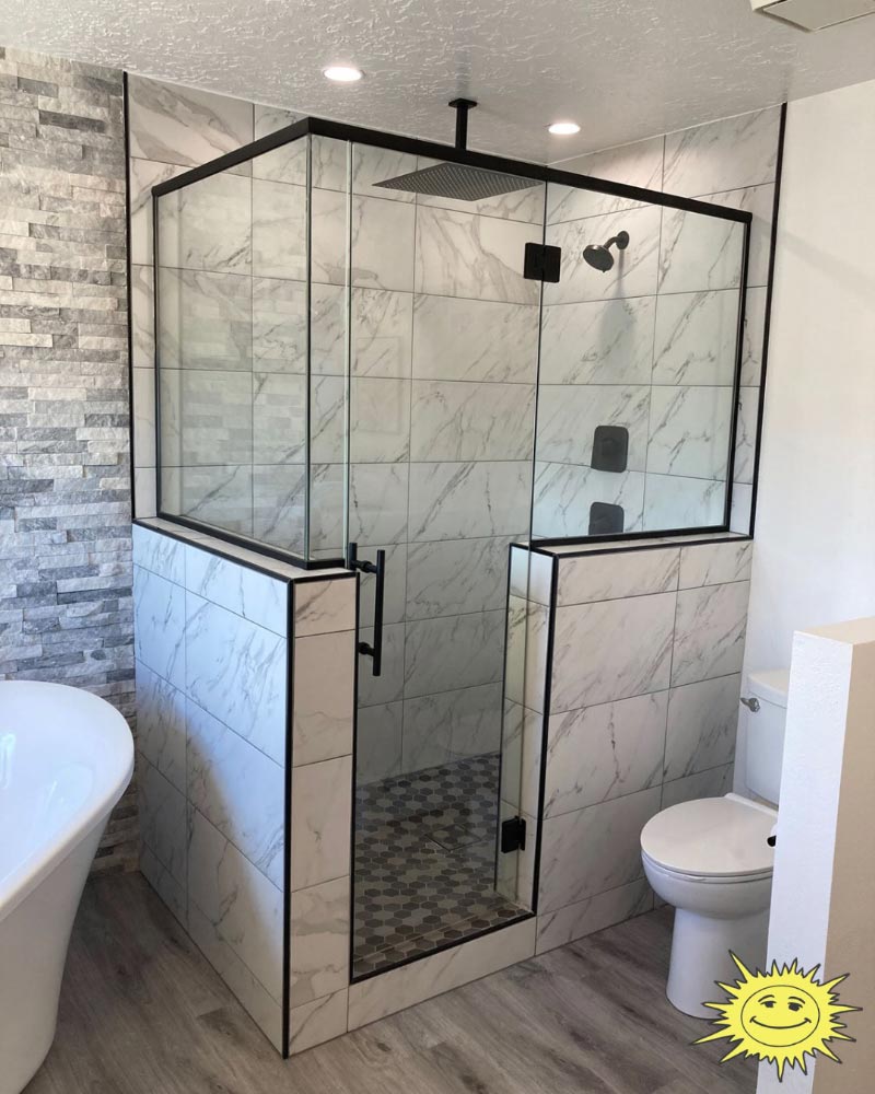a bathroom with a tub and a walk in shower, shower glass is from Sunglass