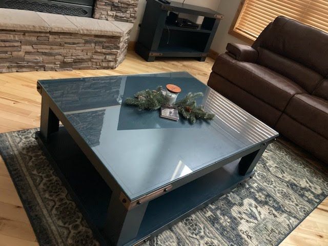 A living room with a couch and a coffee table