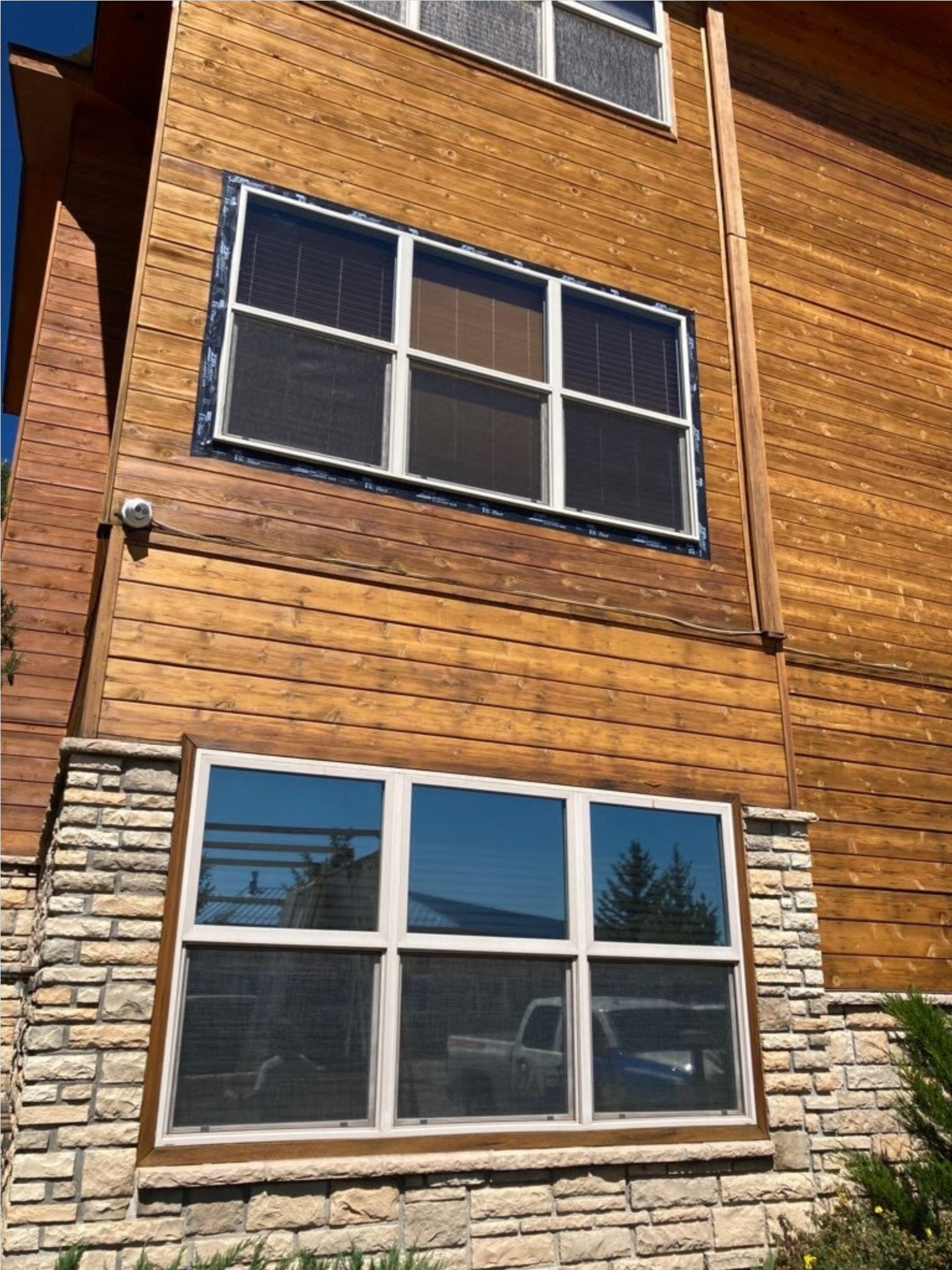 A large wooden building with a lot of windows
